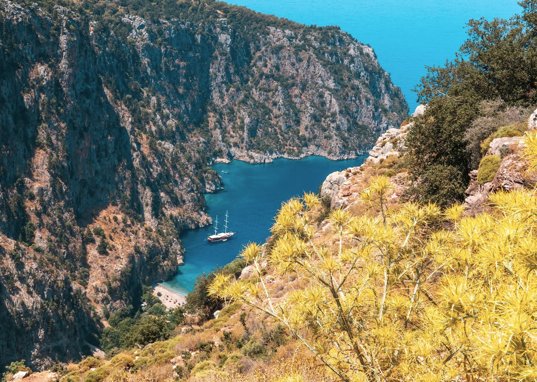 Where is Hot in October? 11 Coastal retreats where summer goes on and the crowds have gone View from above of a small, secluded beach along Turkey's Turquoise Coast