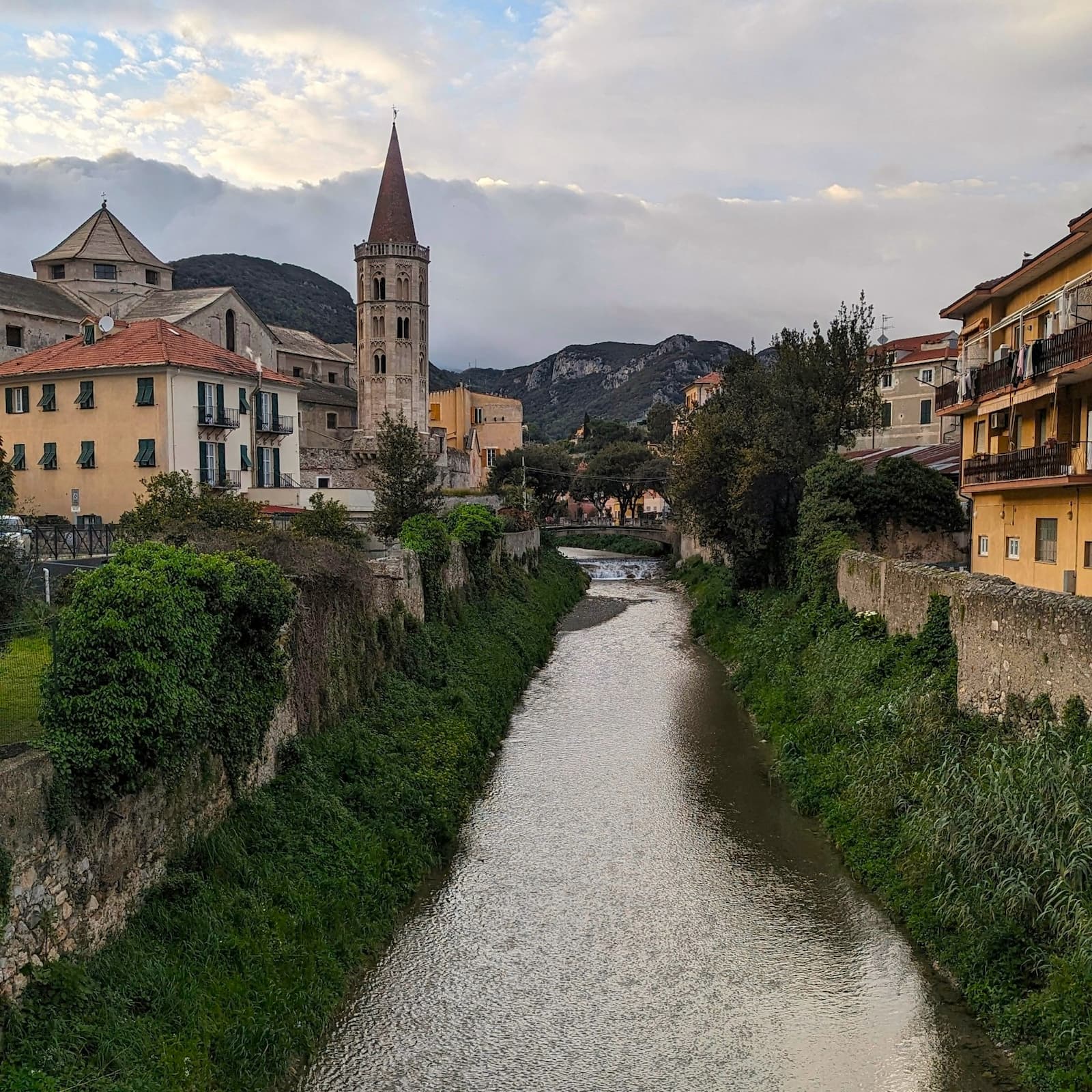 Finalborgo, the inland hilltop town near Finale Ligure A view of a medieval inland town in Liguria Italy, separated by a small river