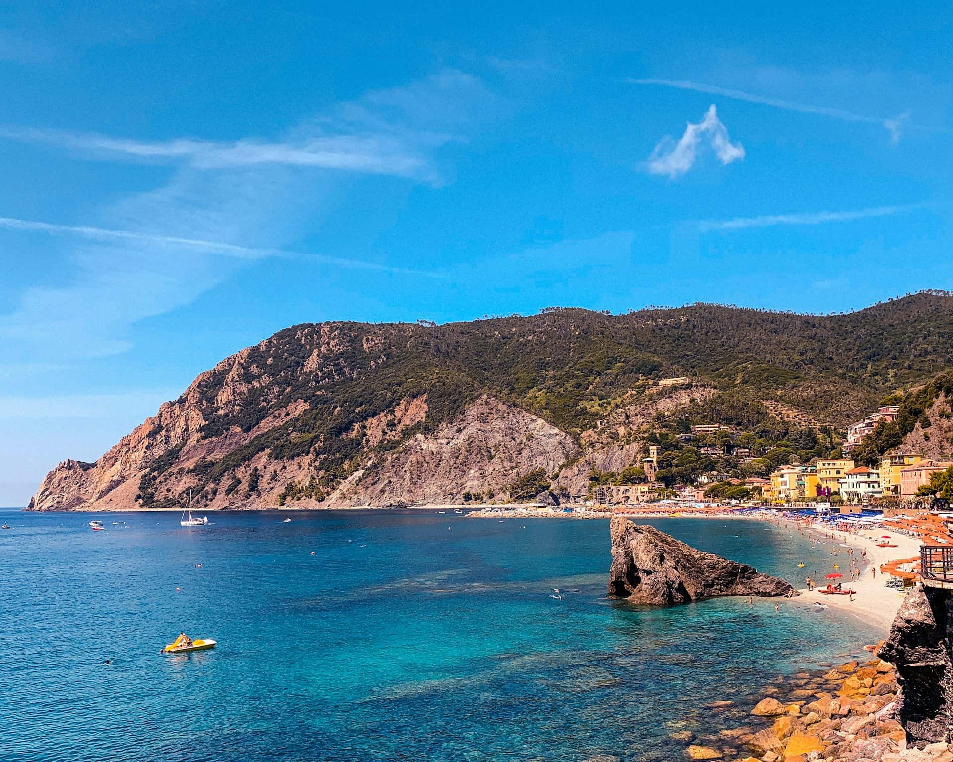 When is the best time to visit Cinque Terre Italy? The answer depends, but summer is never a bad choice for those in search of sunny beaches and warm waters. View of the beach at Monterosso al Mare, Cinque Terre, Italy