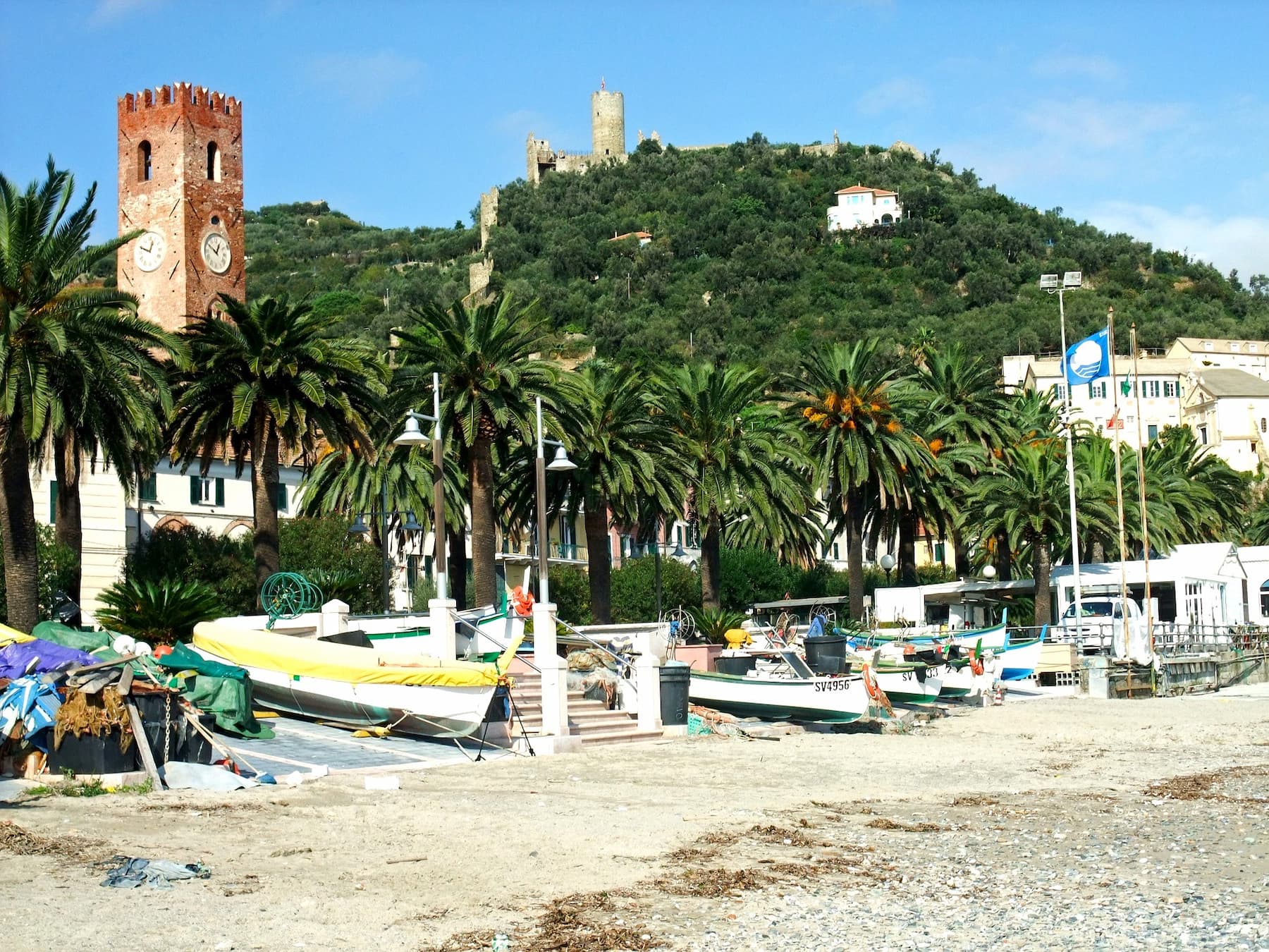 Noli on the Italian Riviera The beach in Noli with the town behind along the Italian Riviera