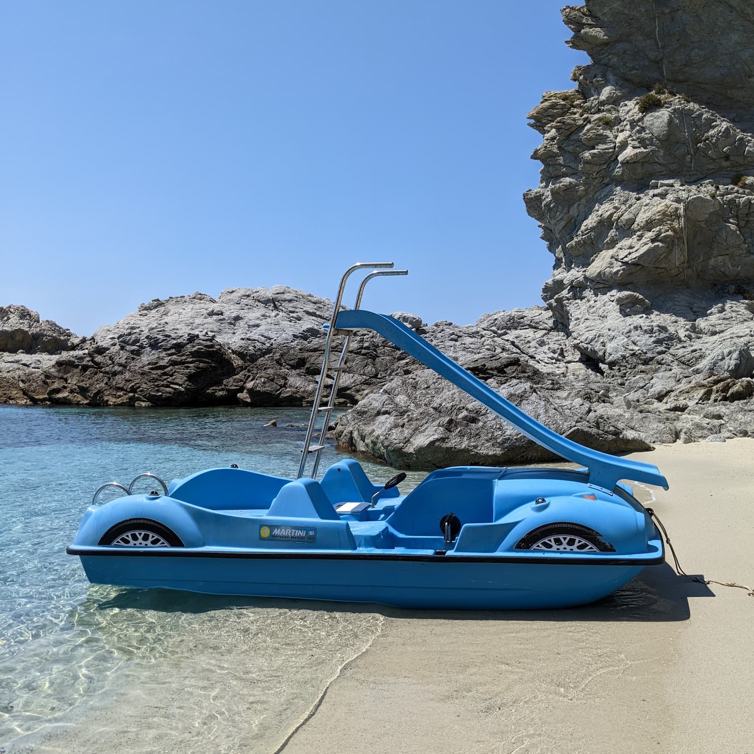 Pedalo boat on a beach in Capo Vaticano, Italy