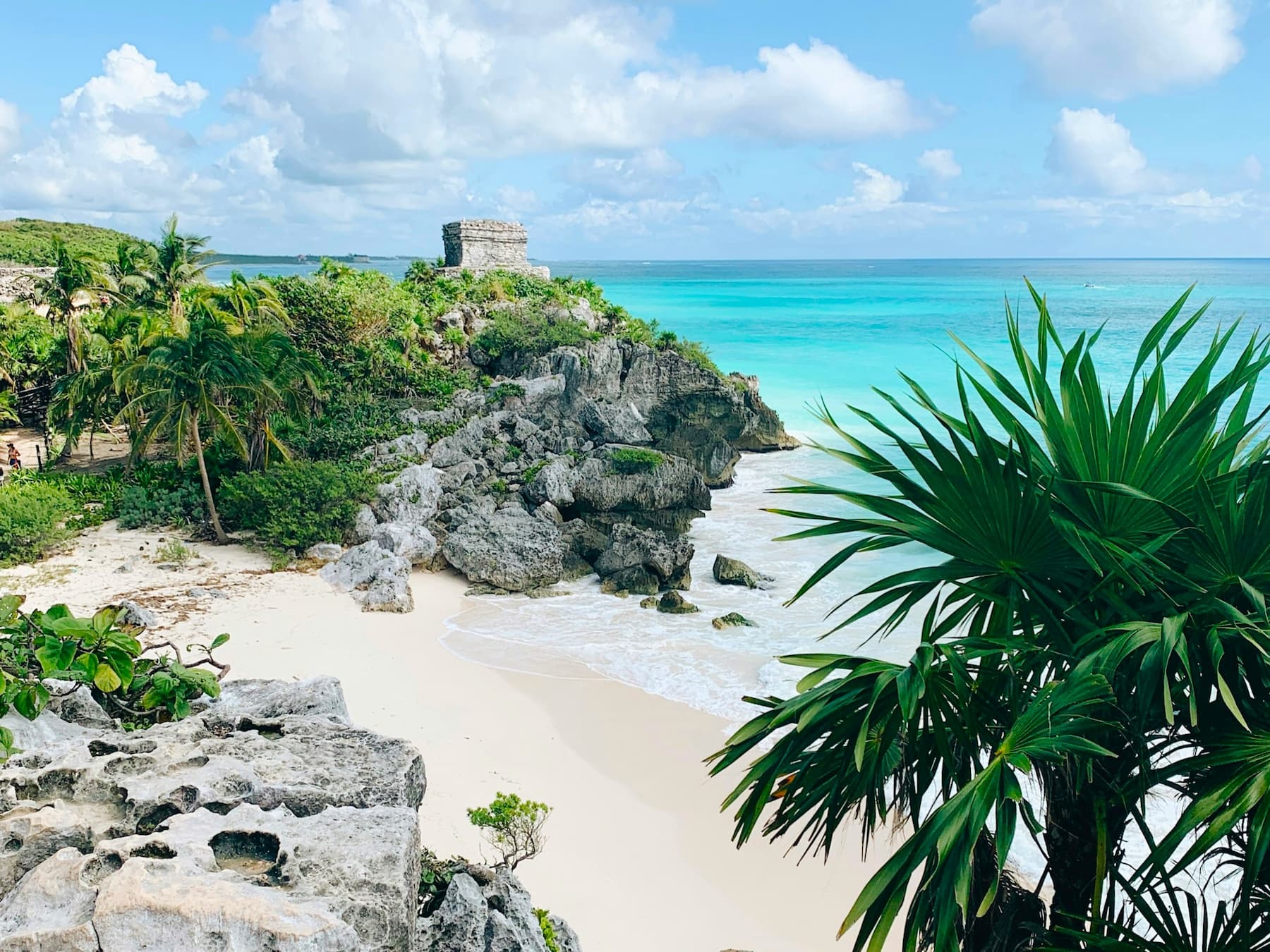 The iconic view of the ruins set above Playa Ruinas in Tulum, Mexico.