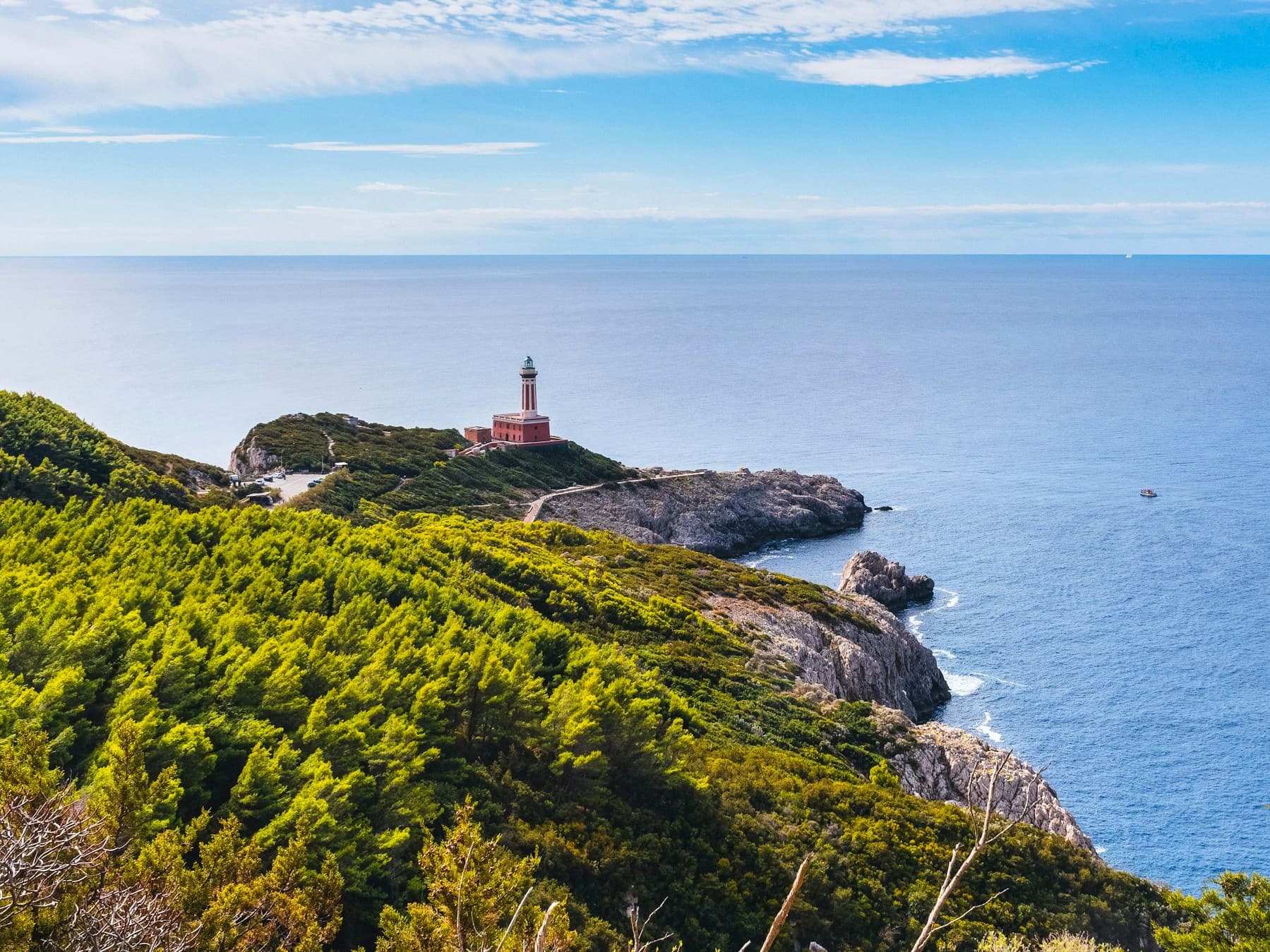 Expansive view of the coast of Capri, including the Punta Carena lighthouse