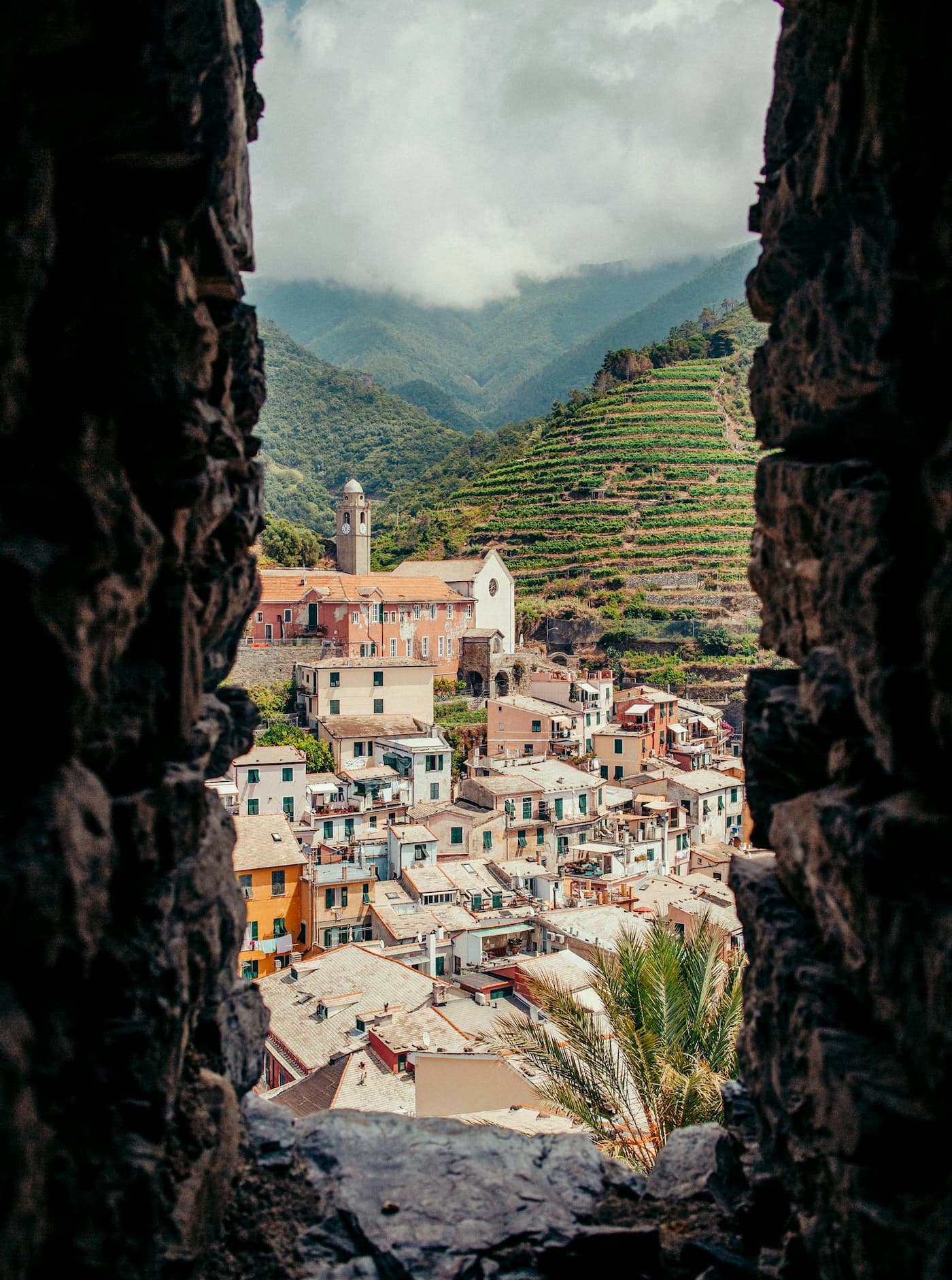 Visiting the Cinque Terre in winter isn't for everybody, but this cool season does have its charm. No tourists plus plenty authentic local experiences are just some of the season's highlights. Framed view of the town of Vernazza, Cinque Terre, Italy