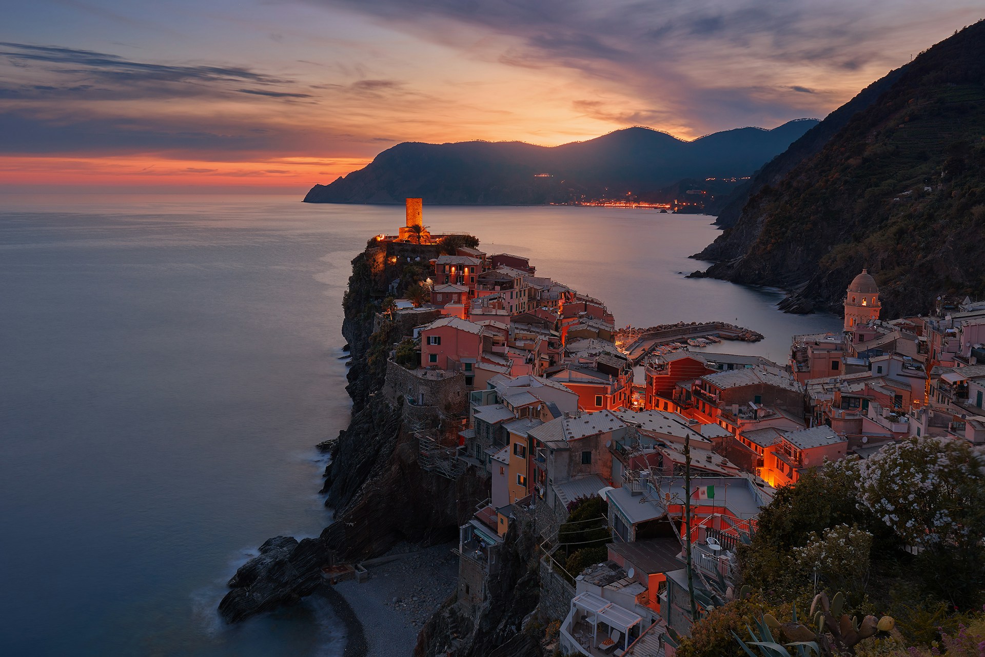 Visiting the Cinque Terre in winter isn't for everybody, but this cool season does have its charm. No tourists plus plenty authentic local experiences are just some of the season's highlights. View of the town of Vernazza from above at sunset, Cinque Terre, Italy