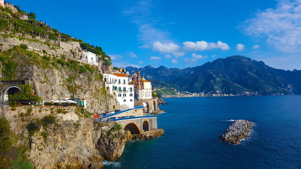 Atrani Italy, one of the Amalfi Coast's least-visited yet most beautiful and best preserved village, is sandwiched between sea and mountain. Discover this gem.