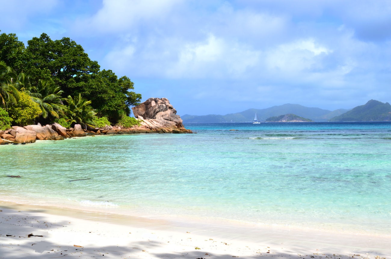 Yacht sailing off Anse Severe in La Digue